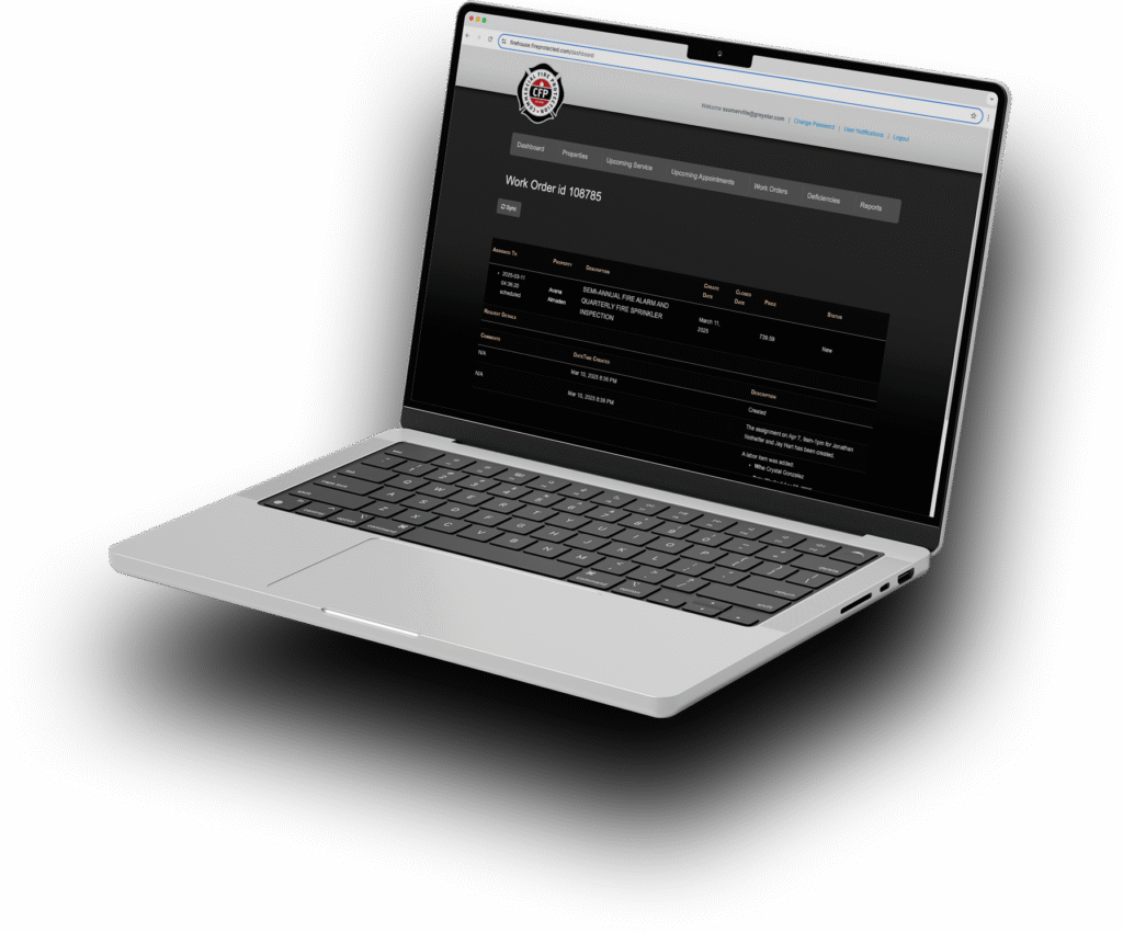 Laptop showing Newport Beach fire safety company's work order for sprinkler inspection.