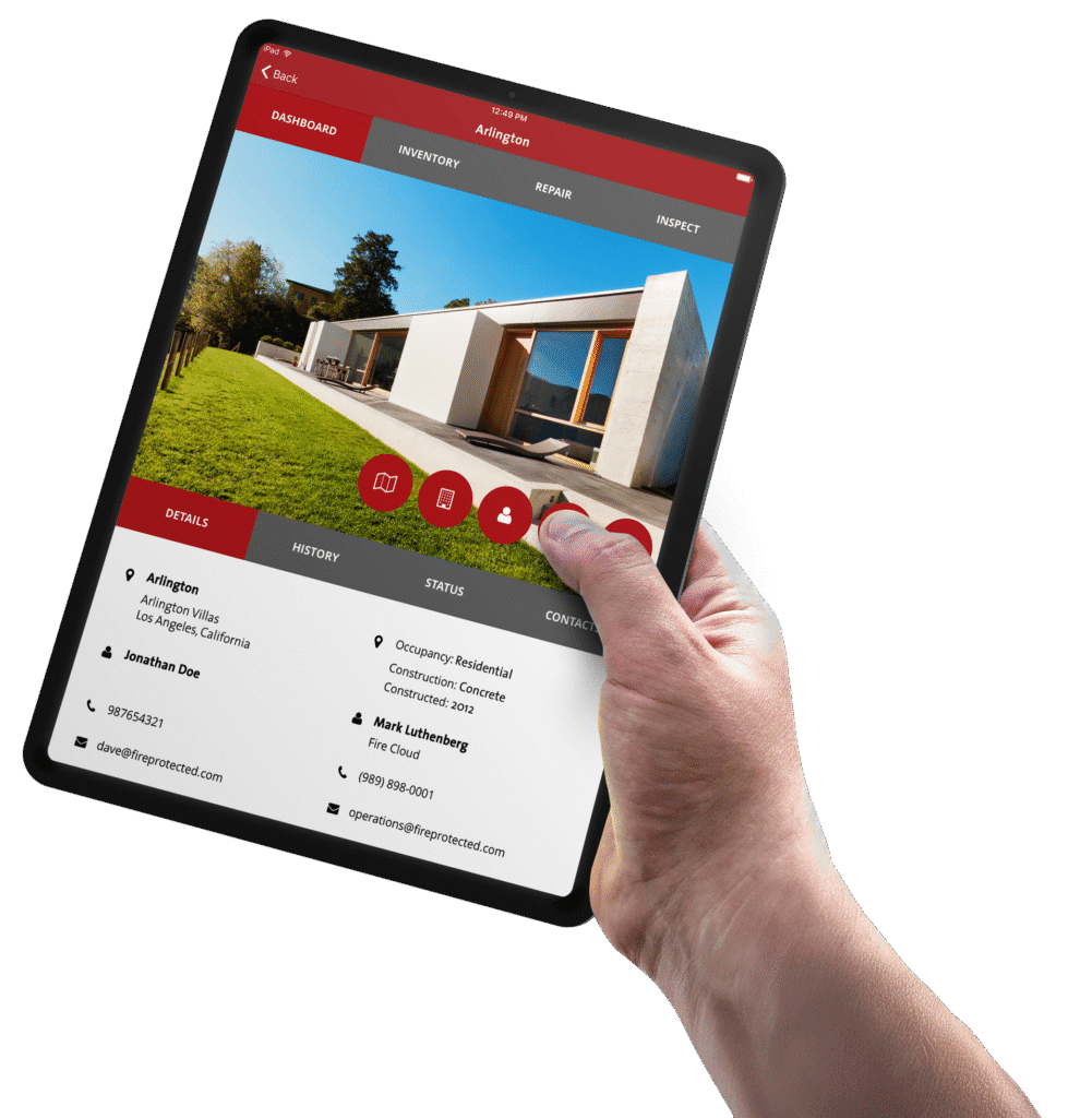 Hand using a tablet to inspect property for Newport Beach CA fire safety company.