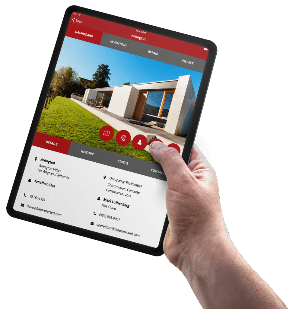 Hand using a tablet to inspect property for Newport Beach CA fire safety company.